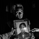 Martin Sauk shows a photo of his daughter Adelina Sauk, who was trafficked and later died in Malaysia.
